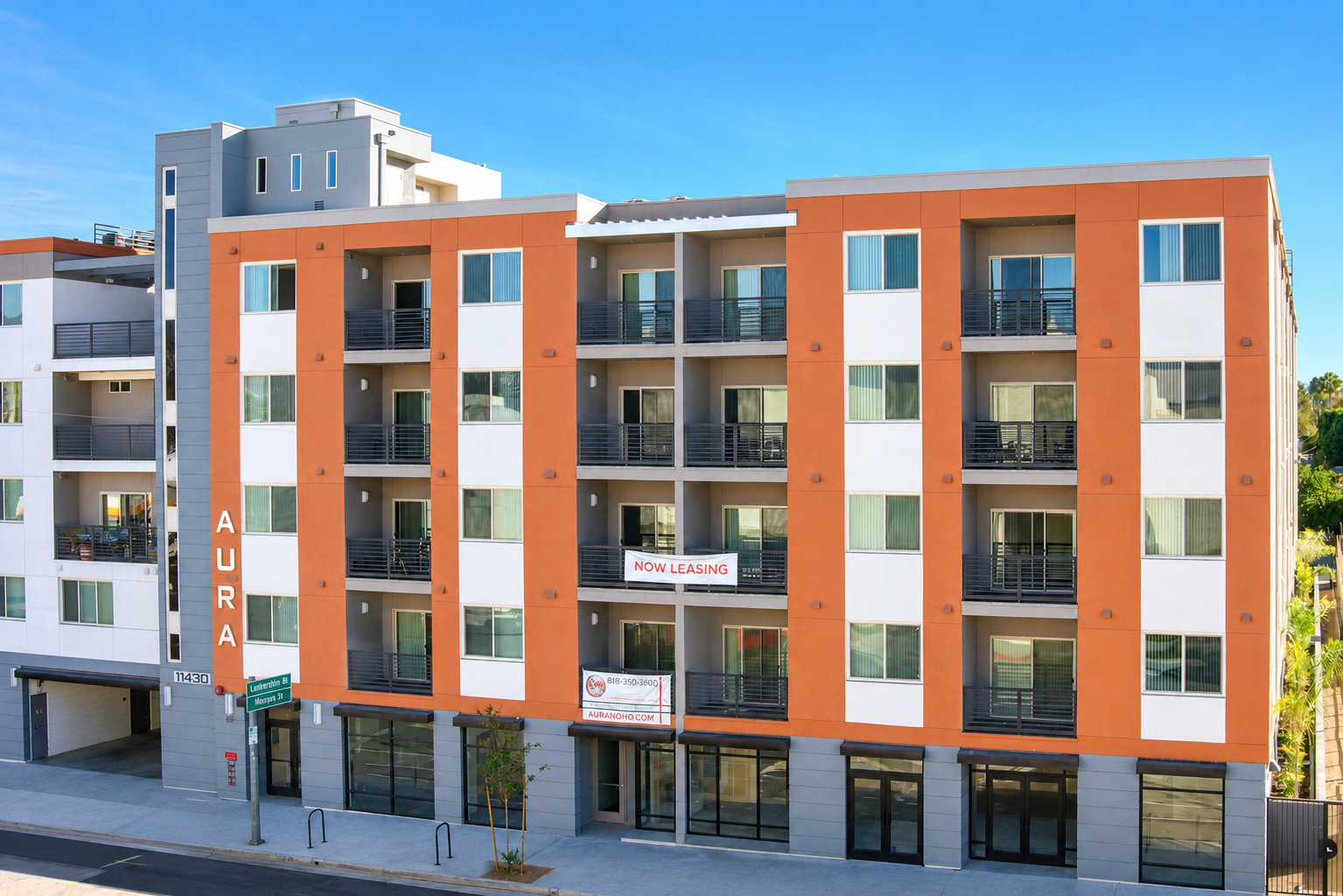 Aura NoHo apartment building at twilight